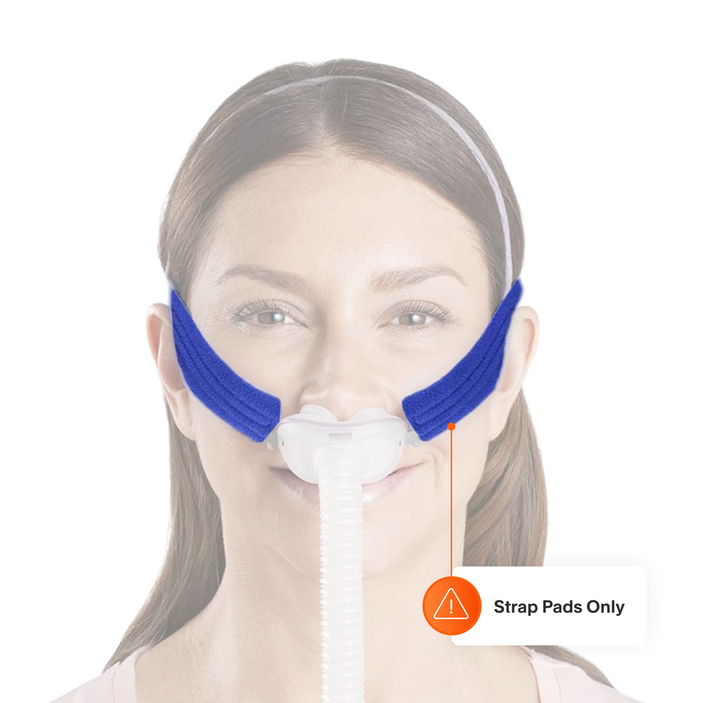 Woman wearing a CPAP mask with blue Pad A Cheek strap pads on her cheeks.