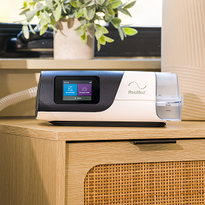 CPAP machine resting on a bedside table