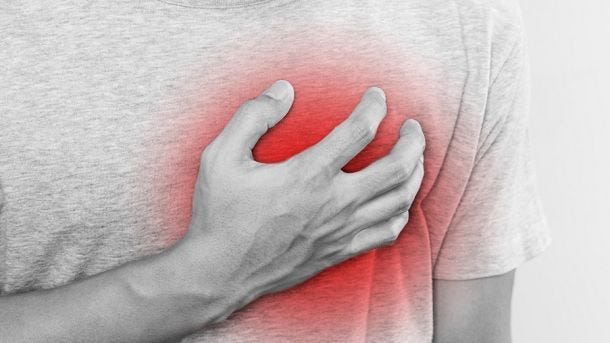 man holding chest