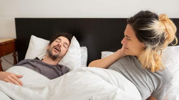 man snoring wakes up wife