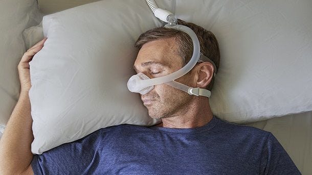 man wearing nasal mask bird eye view