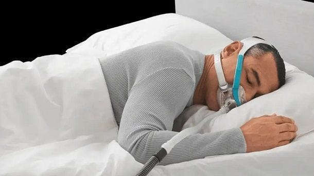 man sleeping with Evora full face mask