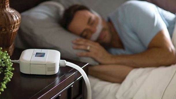 man sleeping with cpap