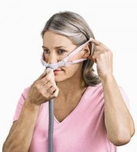 womanwithCPAPmask woman with a CPAP mask