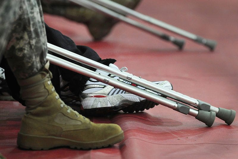 US soldier with crutches.