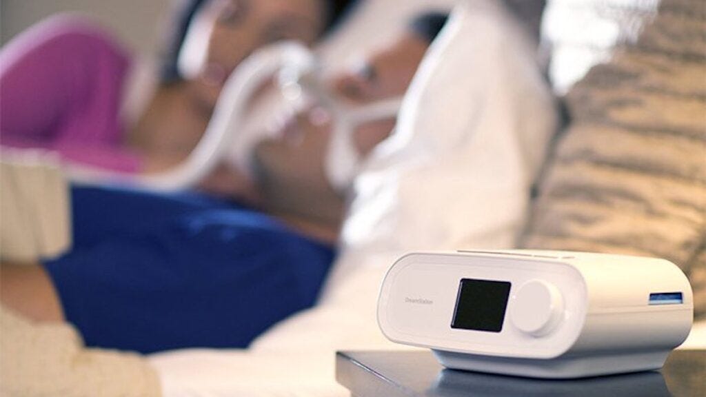 CPAP machine on nightstand.