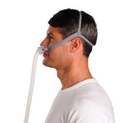 ResMed AirFit  P10 Nasal Pillow CPAP Mask with Headgear (shown on man side view)